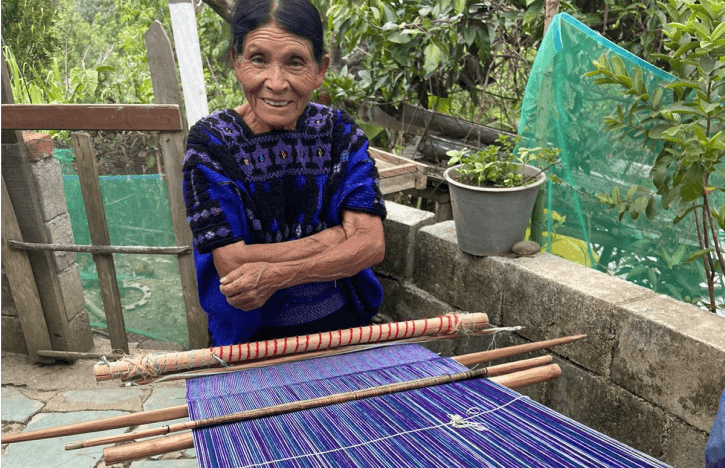 A Caring Hands program graduate at work in their community